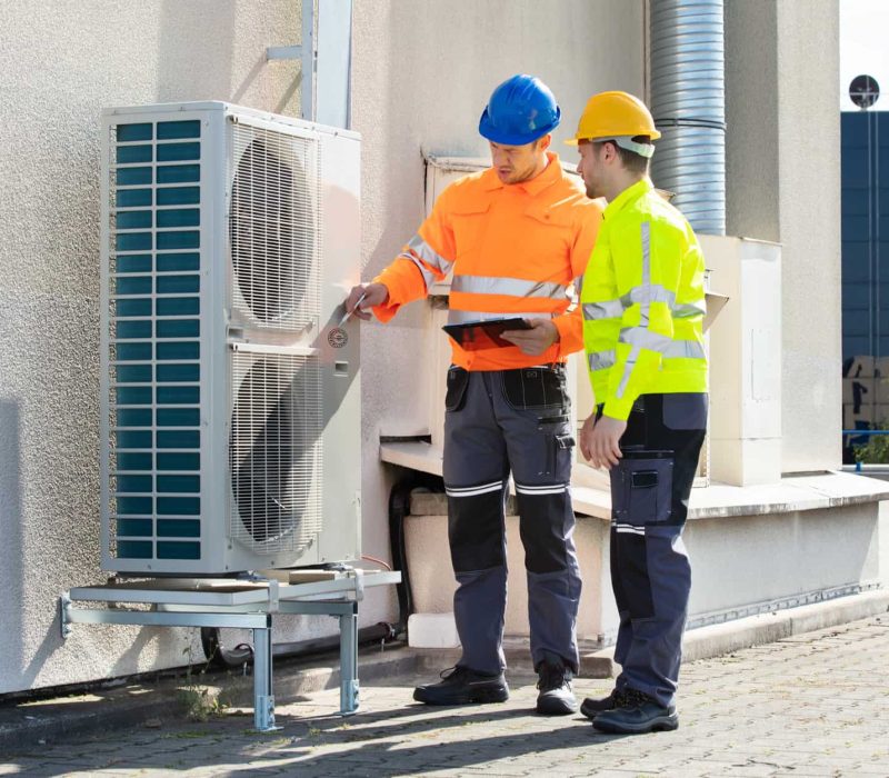 Men-Checking-Air-Conditioning-Unit